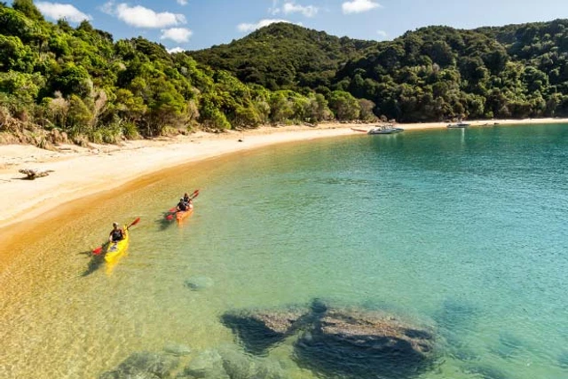 Two kayakers in Abel Tasman National Park
