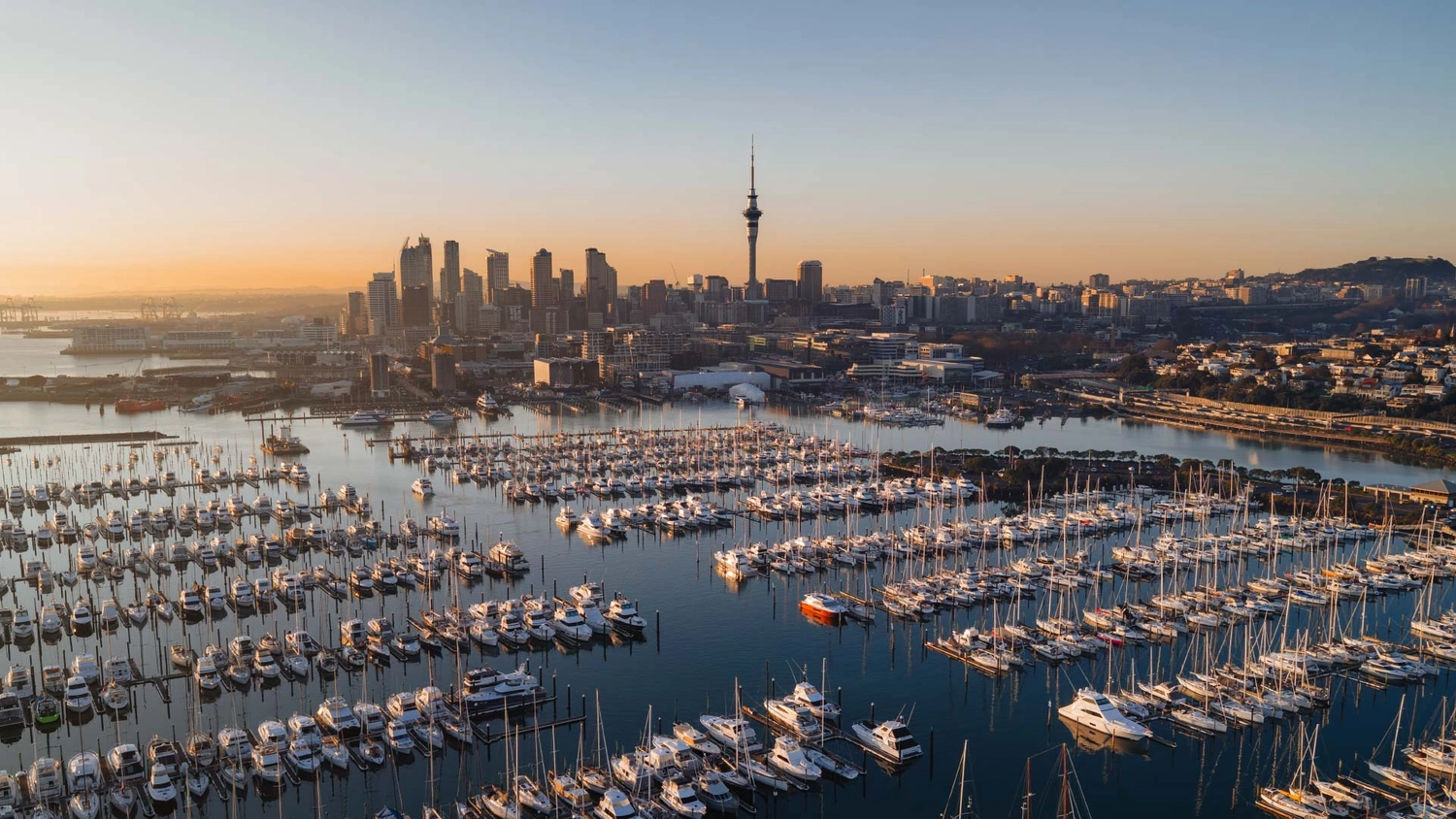 View of Auckland at sunset with a marina in the foreground