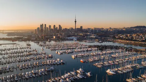 View of Auckland at sunset with a marina in the foreground