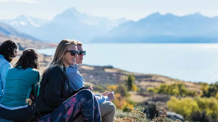 Group of people look at the view at Lake Pukaki