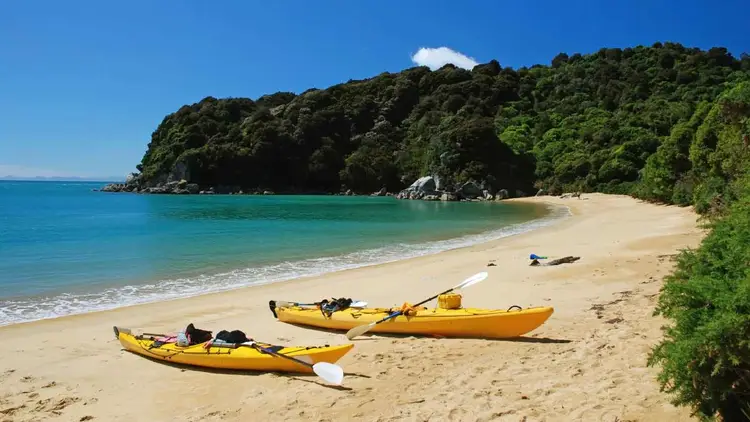 Two kayaks on the beach in Abel Tasman National Park