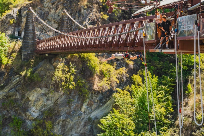 a guy jumping off a bridge bungee jump