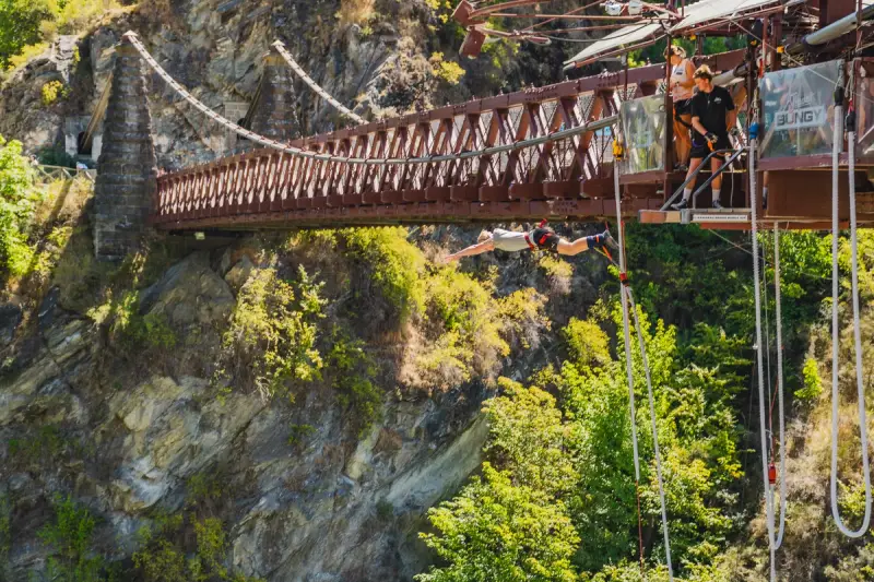 a guy jumping off a bridge bungee jump