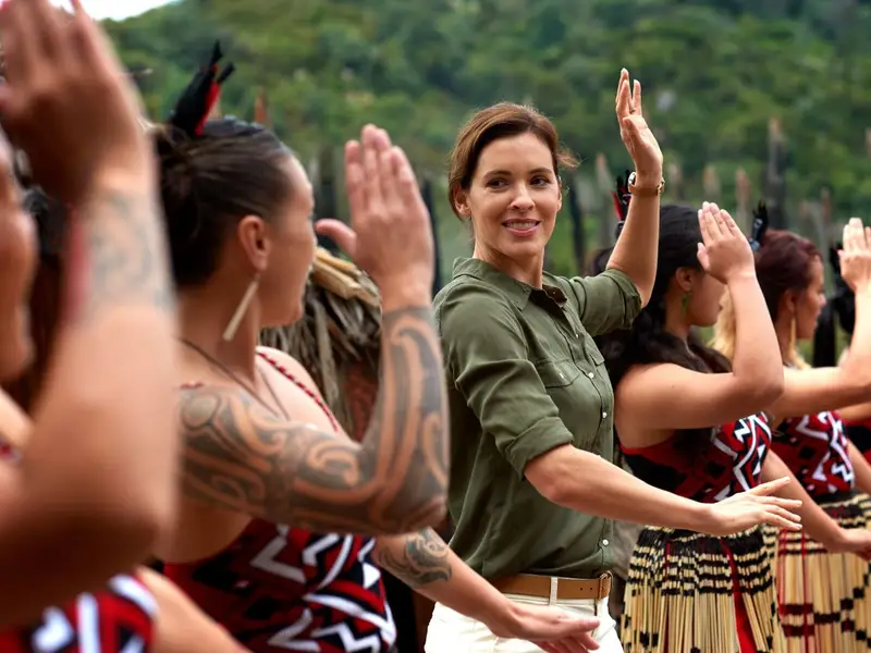Woman taking part in a Maori cultural performance
