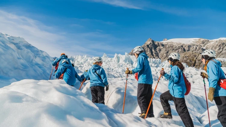 A group of people on a glacier hike in Franz Josef New Zealand