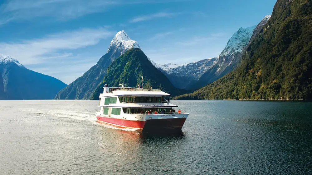 Boat cruising in Milford Sound