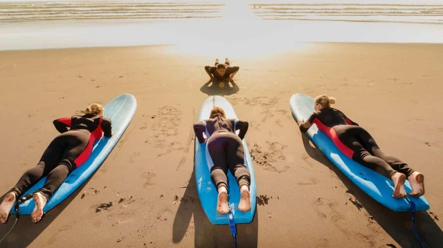 People learning to surf at Raglan