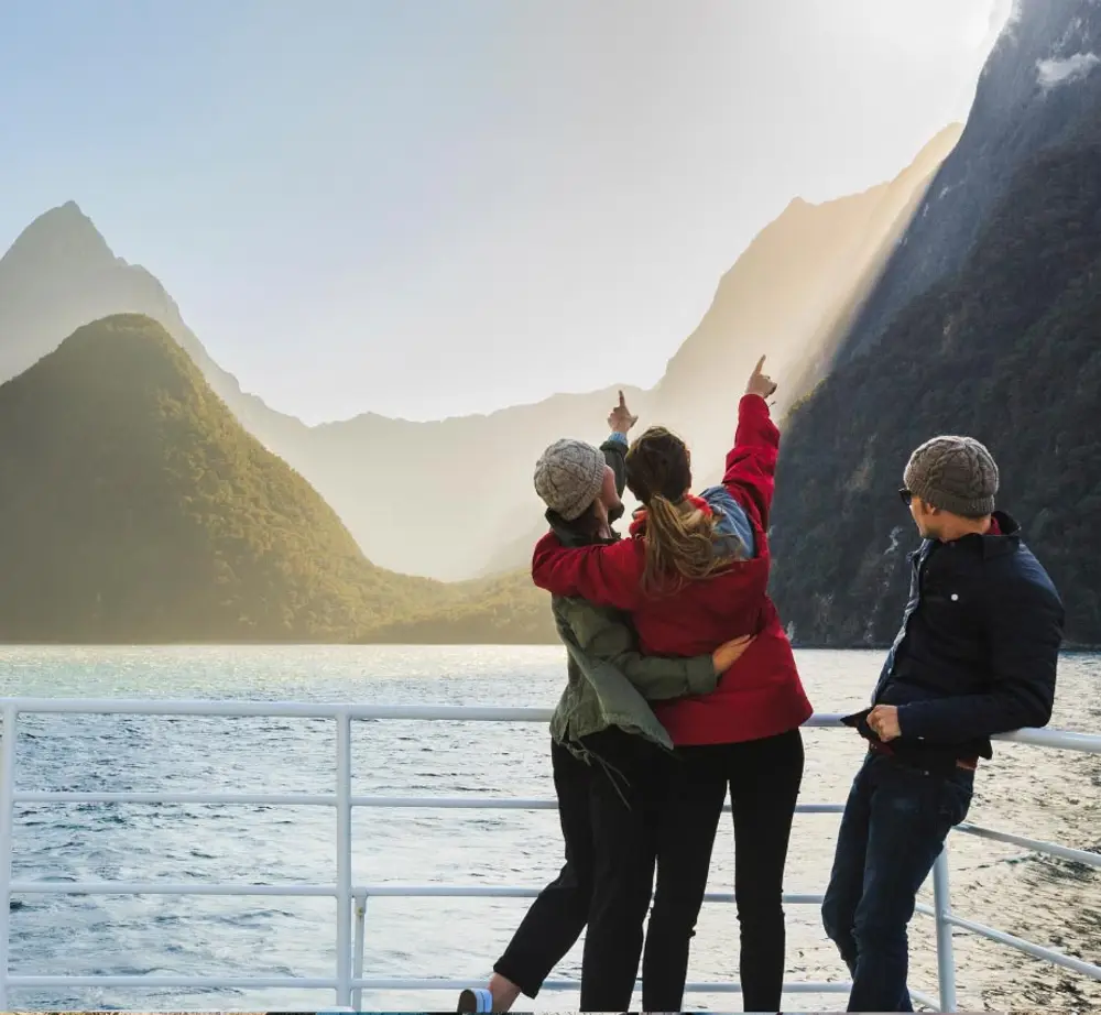 Group of people on a boat cruise in Milford Sound in New Zealand