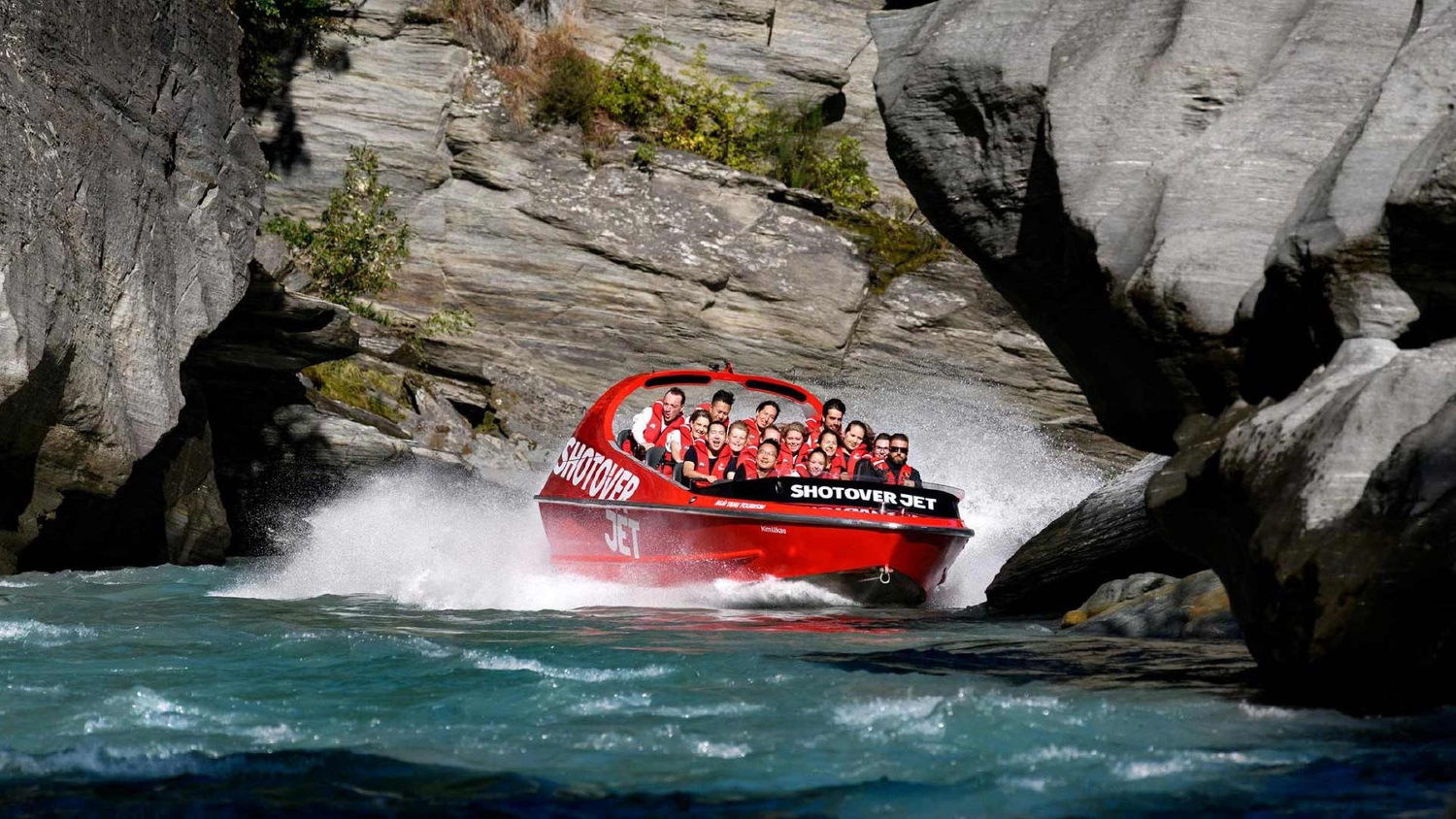 Shotover Jet speeding along the Shotover River