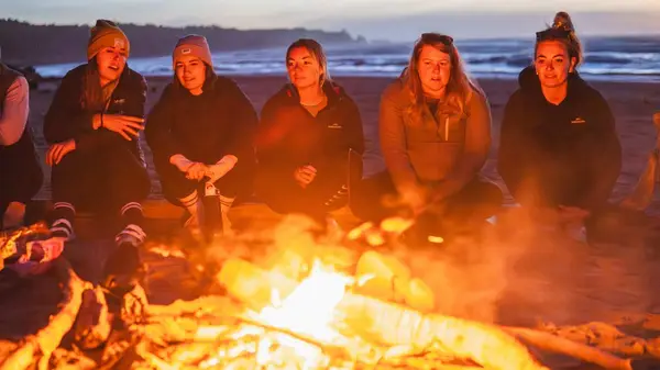 Group of people having a bonfire on a west coast beach