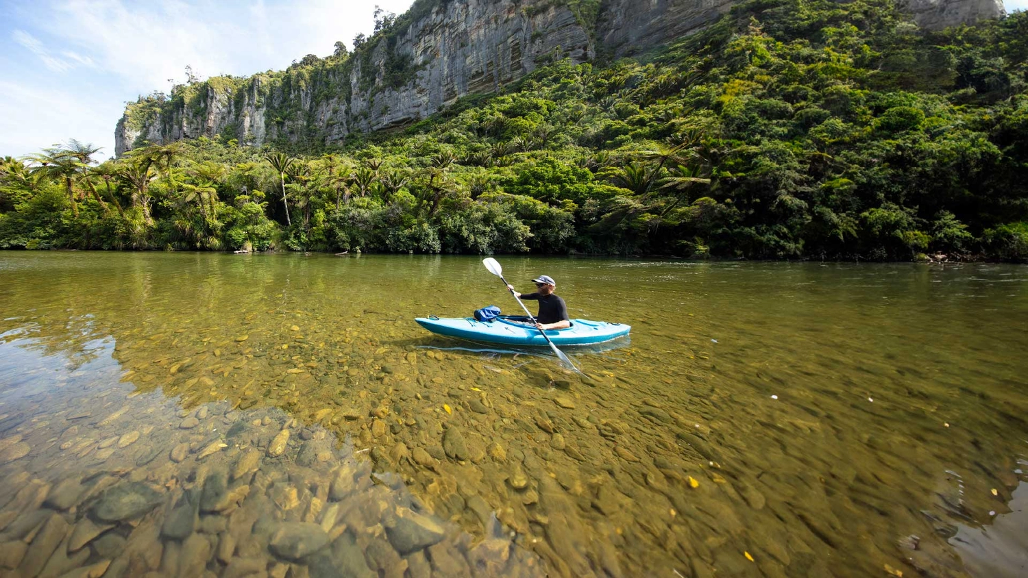 Person kayaking in Punakaiki