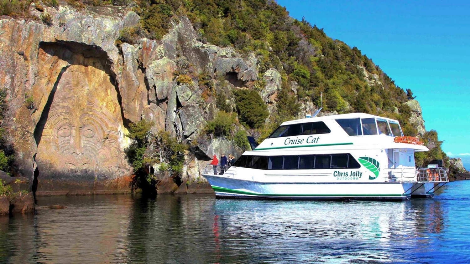 Boat on Lake Taupō viewing some Māori rock carvings