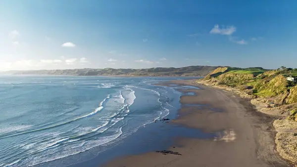 The stunning black sand beach at Raglan