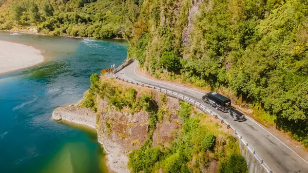 Wild Kiwi coast driving on a road next to a river