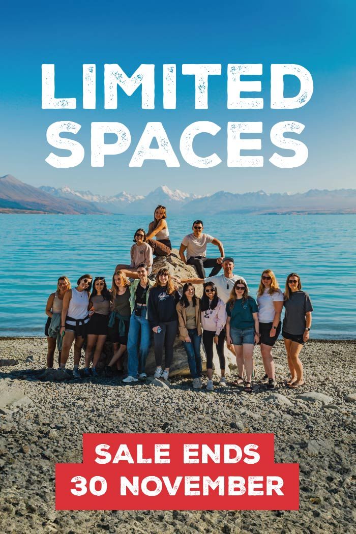 Group of people posing for a photo on the lake front