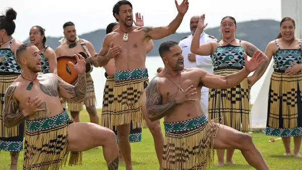 Maori people doing a traditional challenge