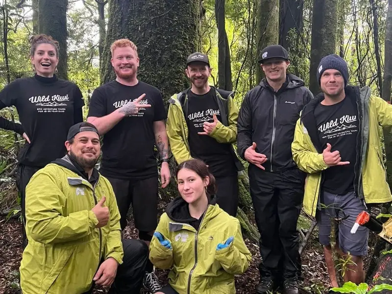 Wild Kiwi team members and guides stand together in native New Zealand forest during a conservation day with Rotorua Canopy Tours, supporting hands-on pest control and habitat protection work that helps protect native wildlife, endangered birds and New Zealand’s wild places.