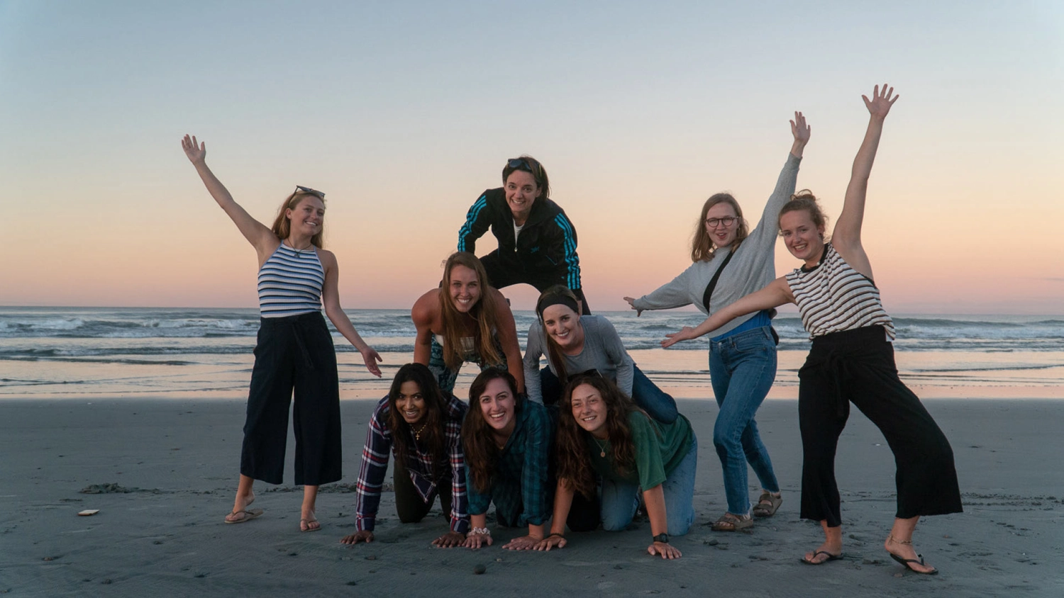 Group of Wild Kiwi guests on the beach at Greymouth in New Zealand