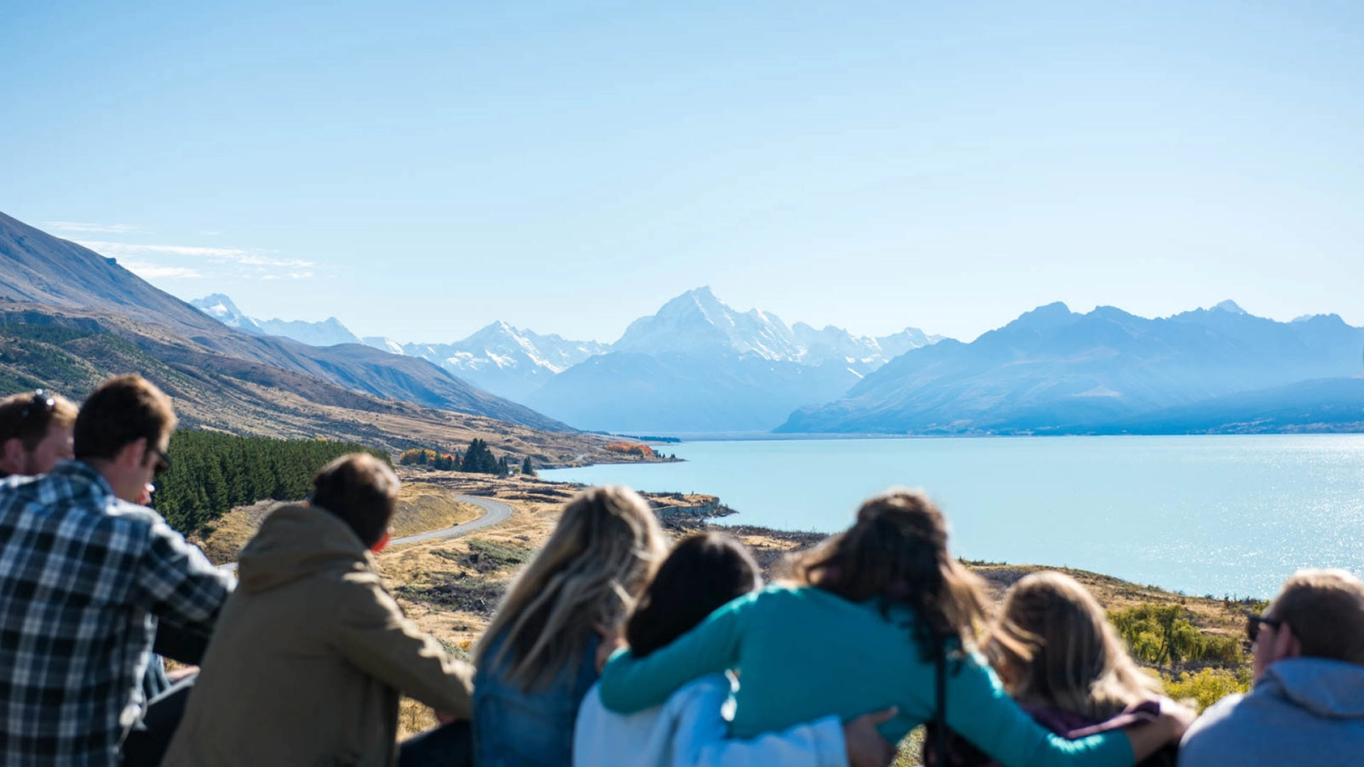 Group of Wild Kiwi guests admire the view over Lake Pukaki