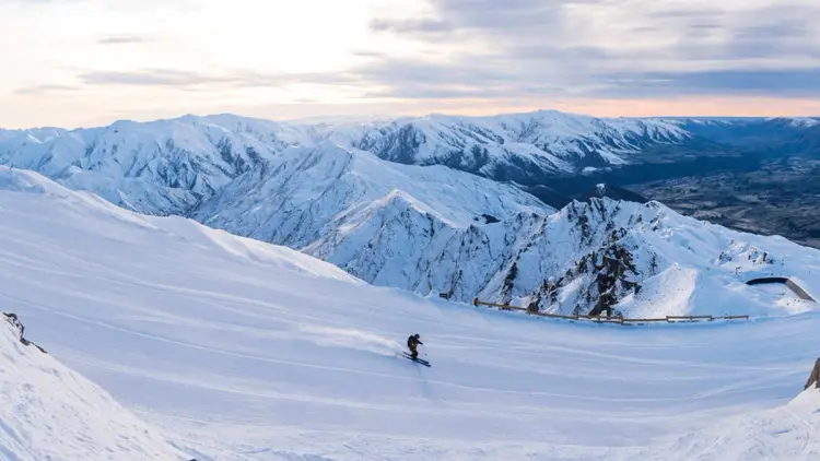 Person skiing down Coronet Peak