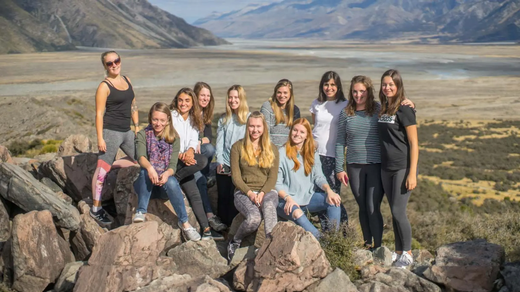 Group of friends pose for a photograph in New Zealand