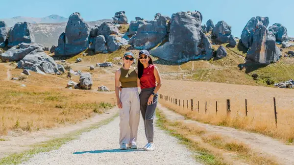 Two people pose for a photo at Castle Rock