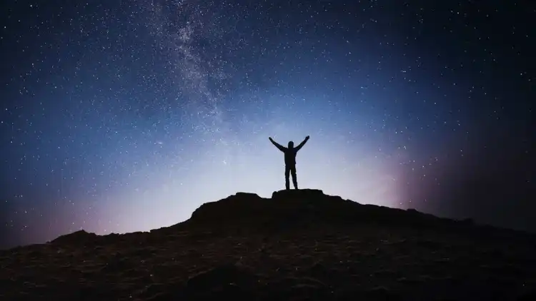 Person stargazing at Lake Tekapo