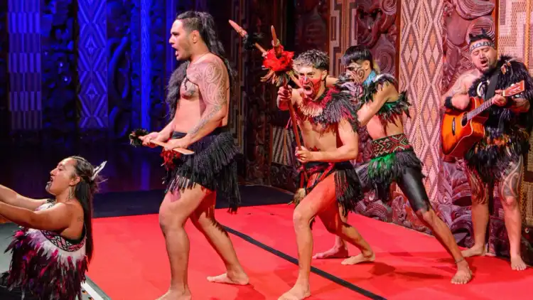 Group of Māori people perform a traditional dance