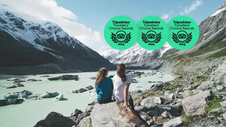 Two people sitting at Mueller Glacier 