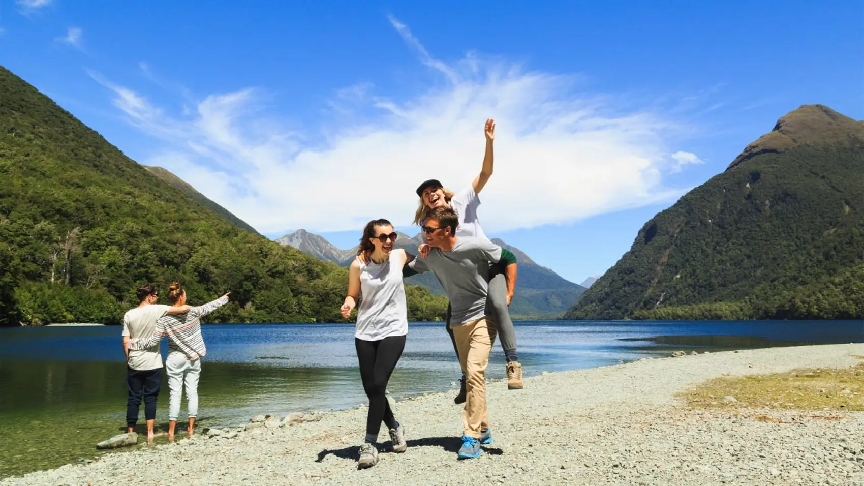 Group of people having fun next to a river in New Zealand