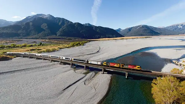 Aerial view of Tranz Alpine train crossing a river