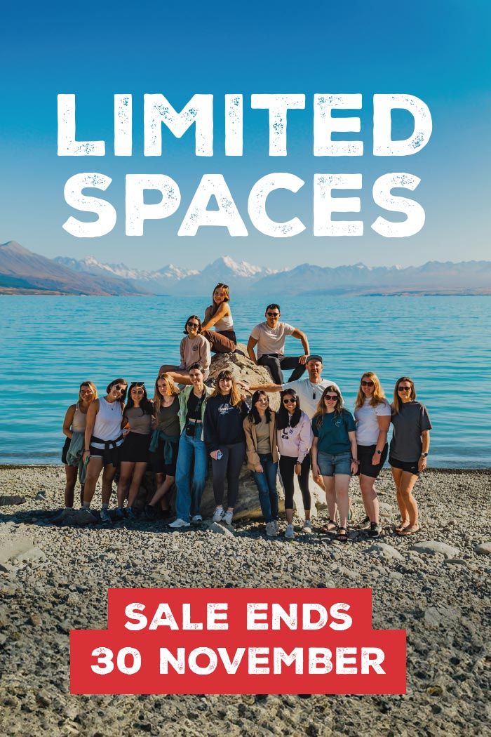 Group of people posing for a photo on the lake front