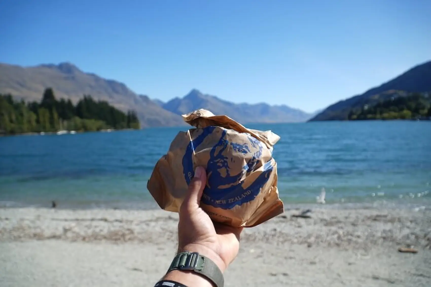 Photo of a person holding a Fergburger in New Zealand