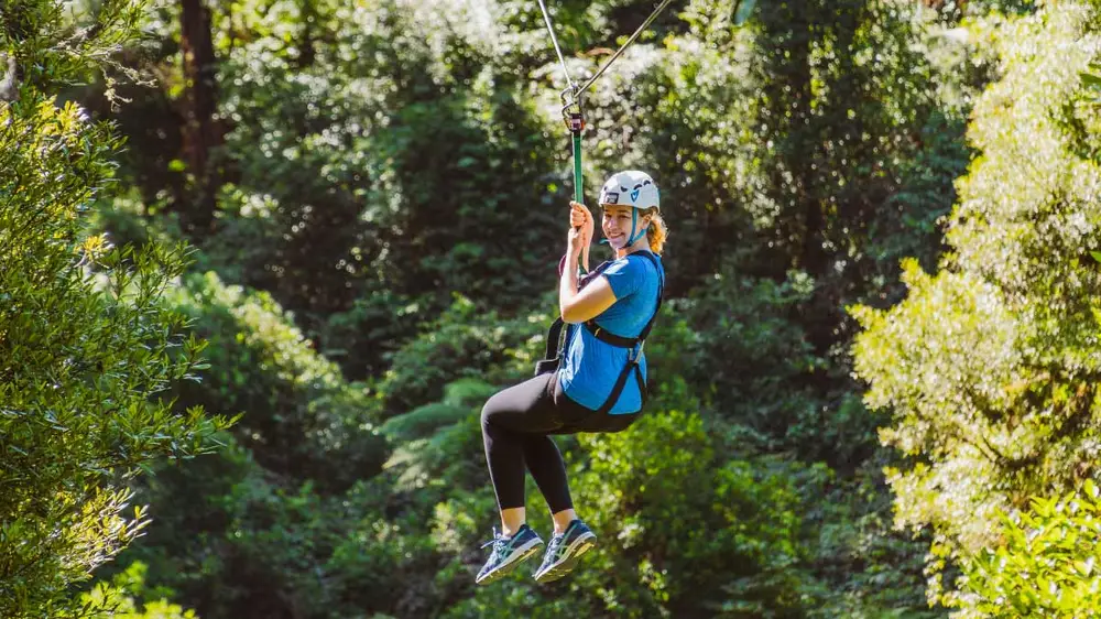 Woman ziplining in Rotorua