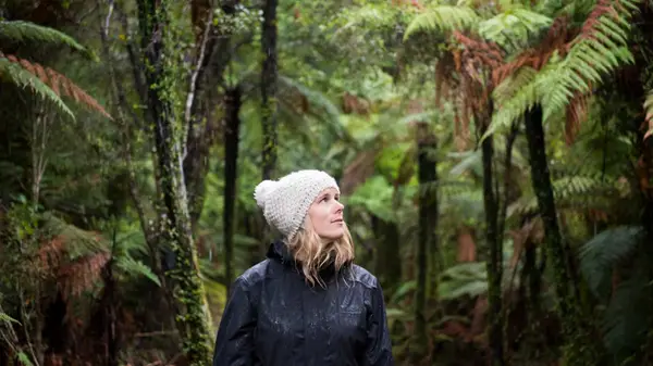 Woman walking in the bush in New Zealand