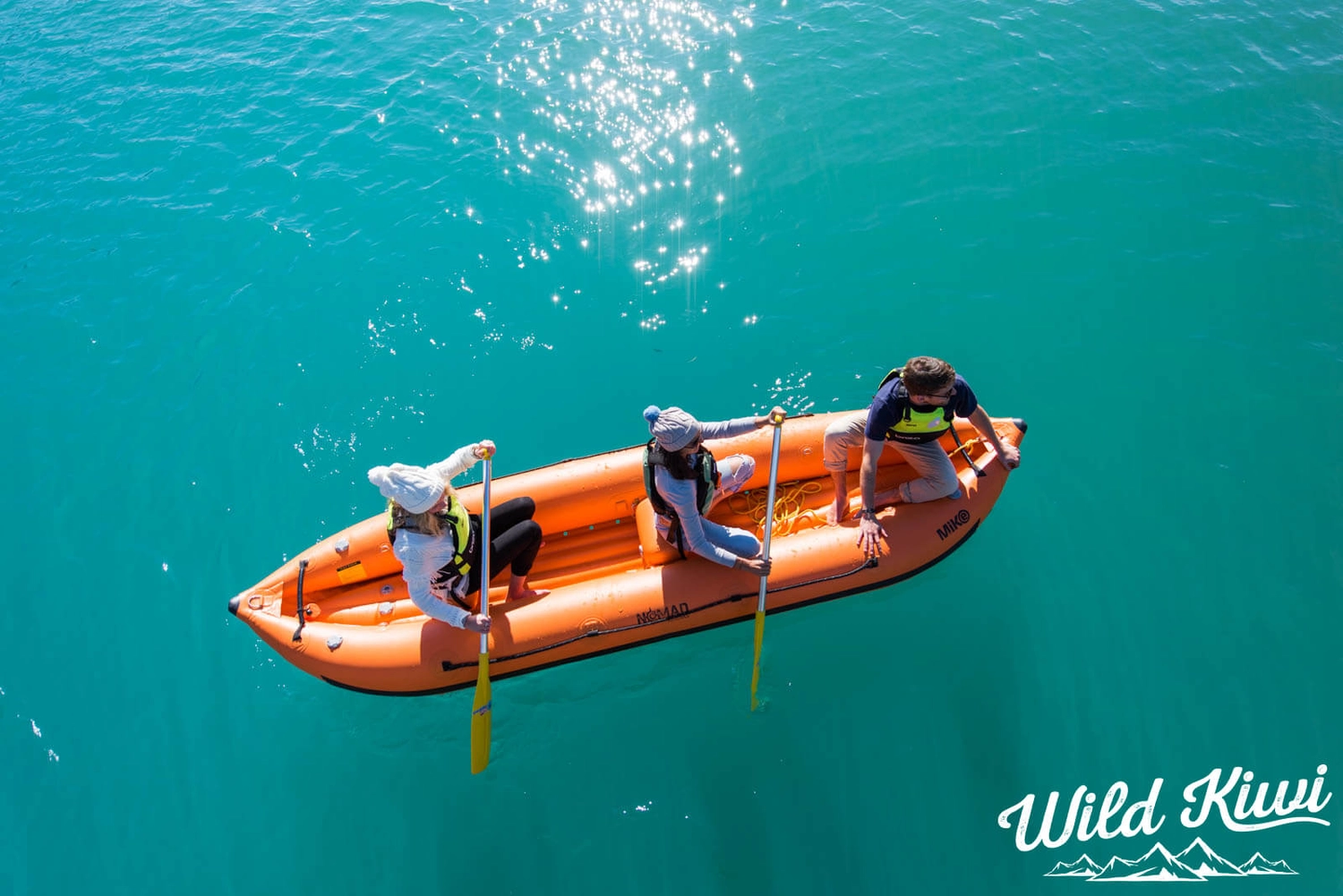 Two people in an inflatable kayak