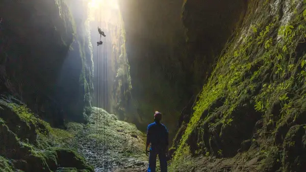 Person abseiling in Waitomo Cave