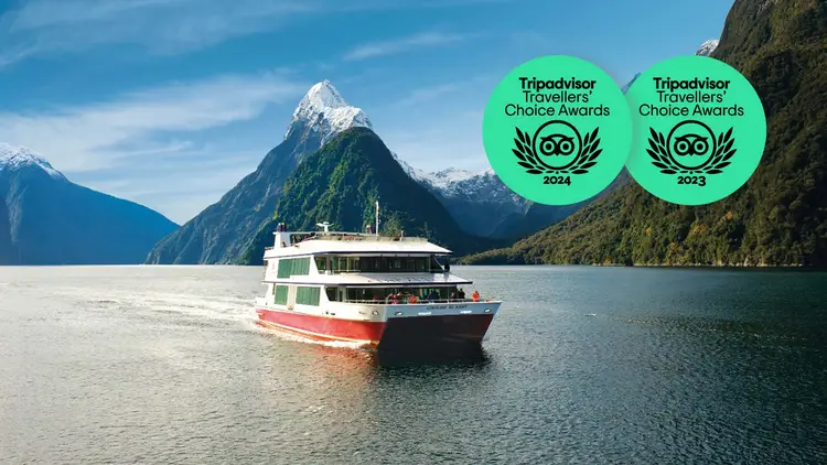 Boat cruising through Milford Sound