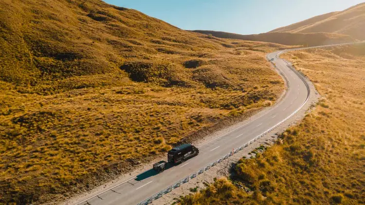 Wild Kiwi vehicle driving through Lindis Pass