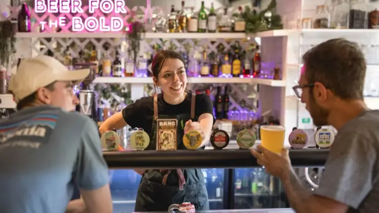 Two people in a pub in New Zealand