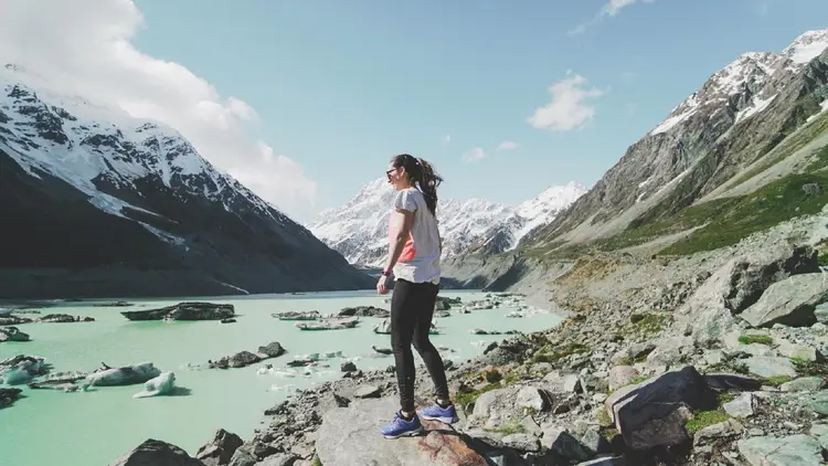 Young woman walking in Mount Cook National Park