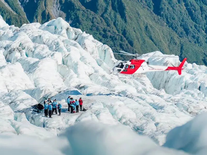 A photo of a group of people atop Franz Josef Glacier on a South Island premium tour of New Zealand with Wild Kiwi.