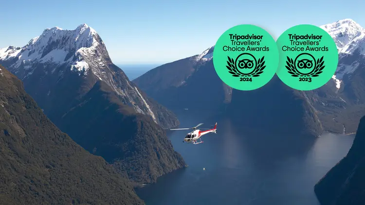 Helicopter flying over Milford Sound