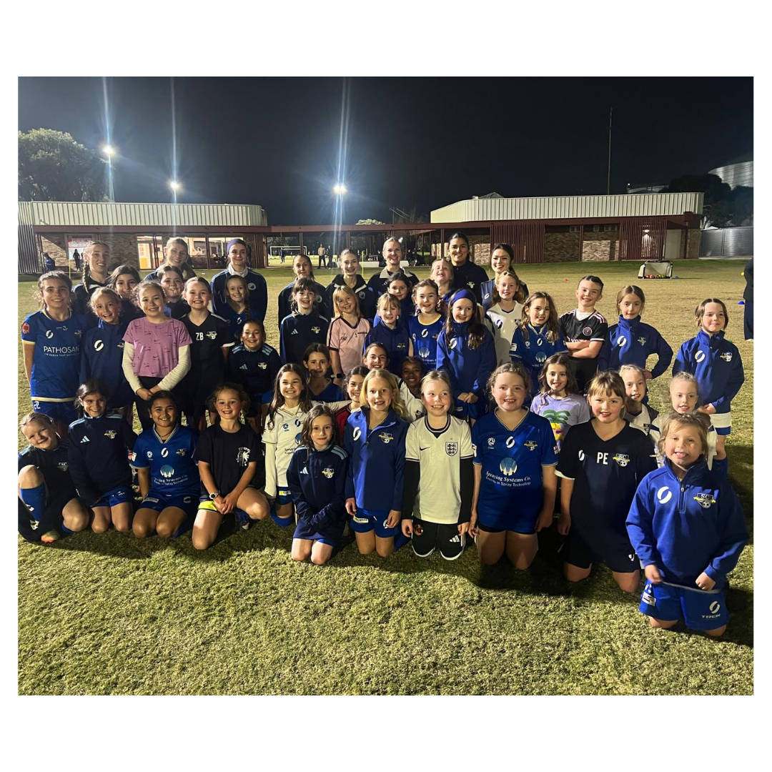 group photo of senior women players and junior girls