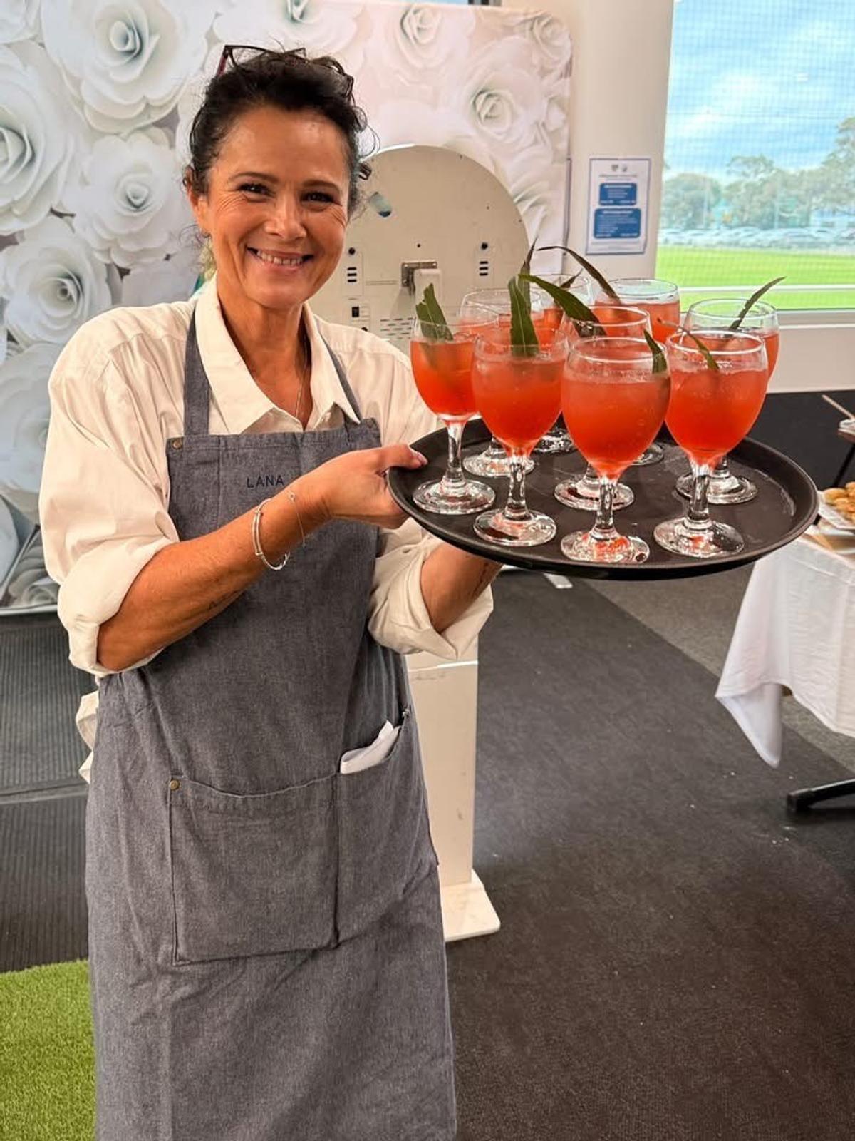 photo of Lana with tray of cocktails