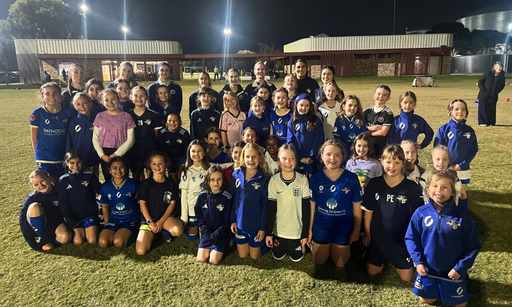 group photo of senior women players and junior girls