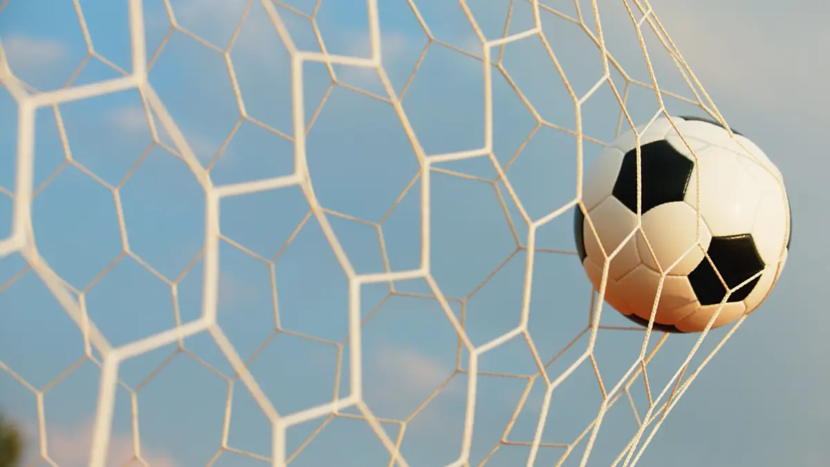 photo of ball in soccer goal