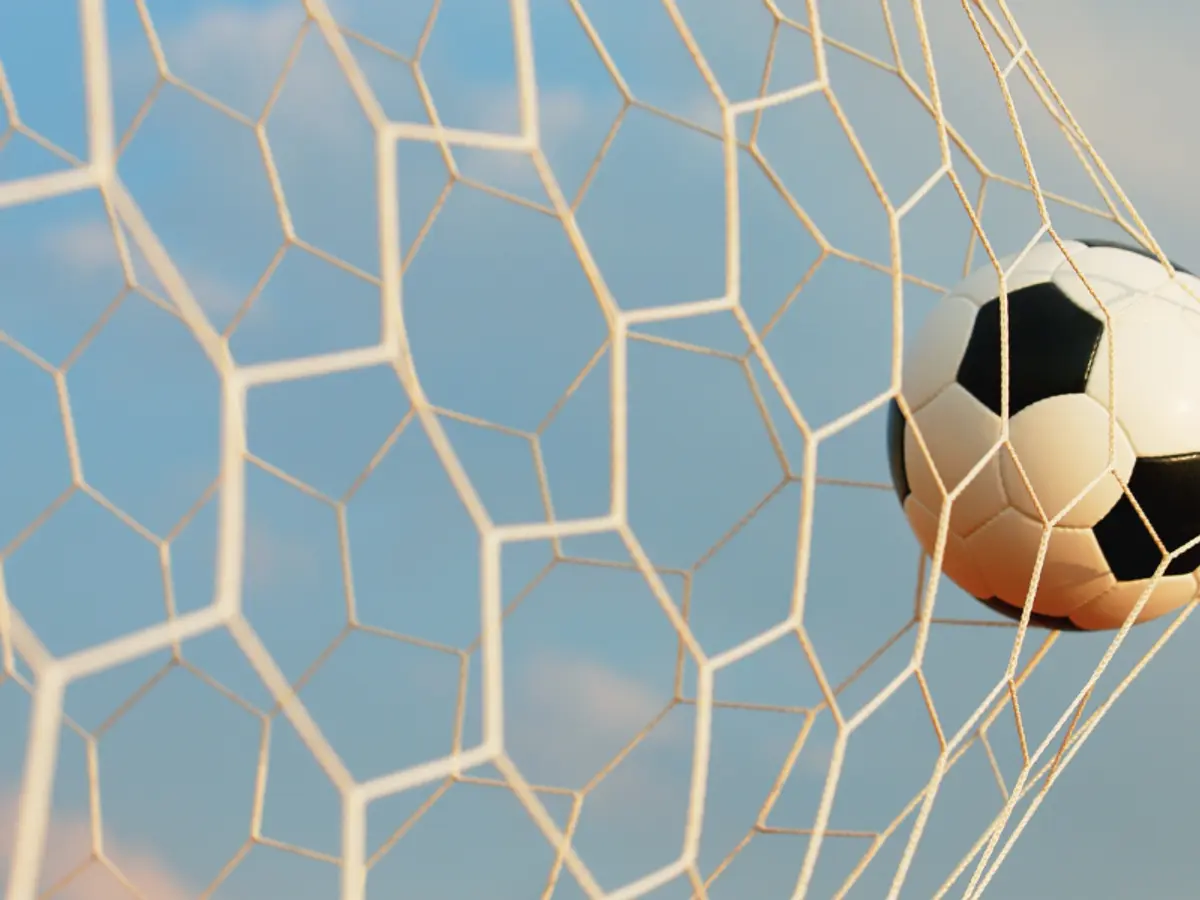 photo of ball in soccer goal