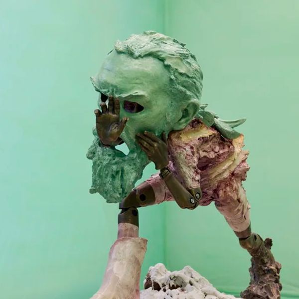 Pursed lip, fan in hand