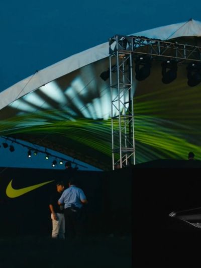 Nike Golf experiential installation outdoors with Nike logo and screens